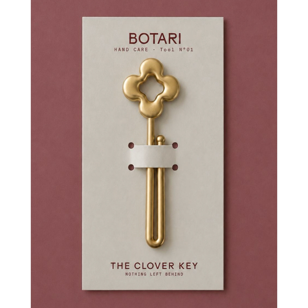 Botari's Clover Key metal tube squeezer mounted on an off-white Botari product card against a mauve background.