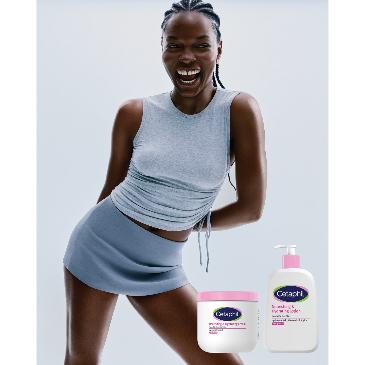 A smiling model with braided hair in a grey tank top and skirt alongside product overlays for Cetaphil Nourishing & Hydrating Cream and Nourishing & Hydrating Lotion.
