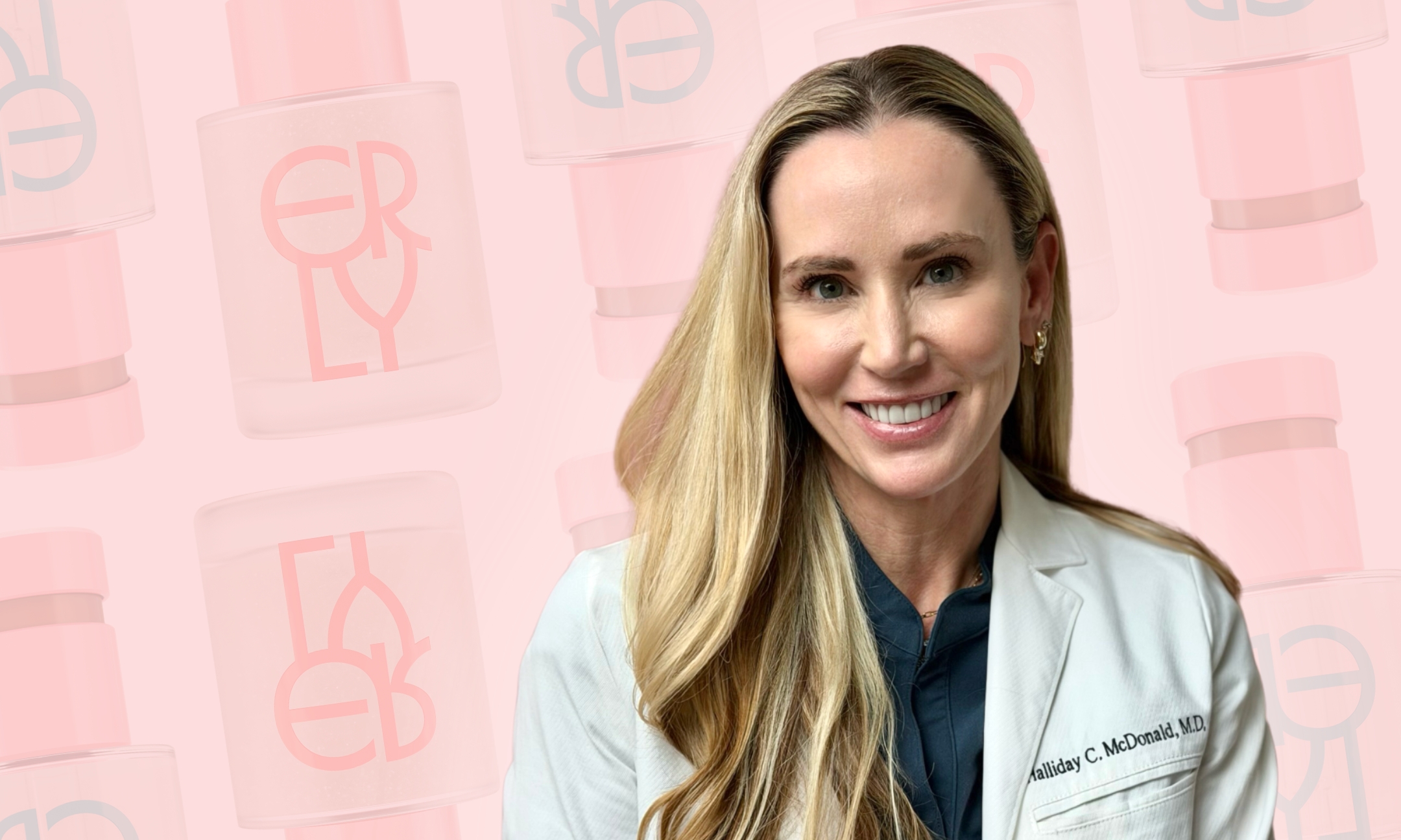Board-certified dermatologist and ERLY co-founder Dr. Hallie McDonald (Halliday C. McDonald, M.D.) smiling in her white medical coat against a light pink background patterned with frosted ERLY skincare bottles, featured in an interview on Beauty News Daily.