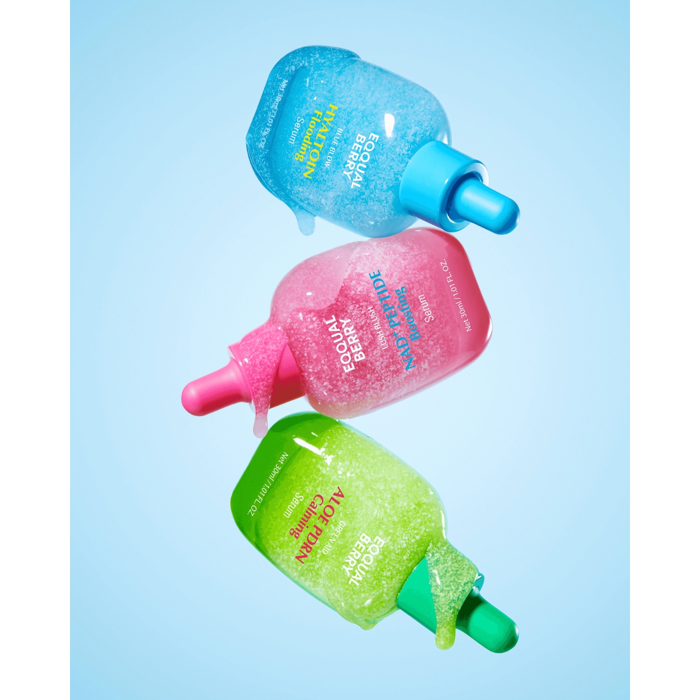 Three bottles of Eqqualberry serums including Hyaltonin Flooding, NAD+ Peptide Boosting, and Aloe PDRN Calming floating against a light blue backdrop, featured in the brand's UK launch announcement on Beauty News Daily.