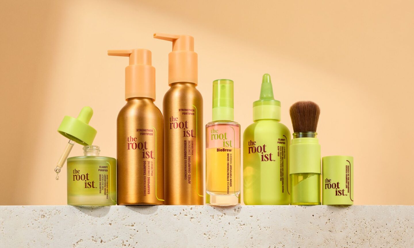 The Rootist products lined up in front of a peach background