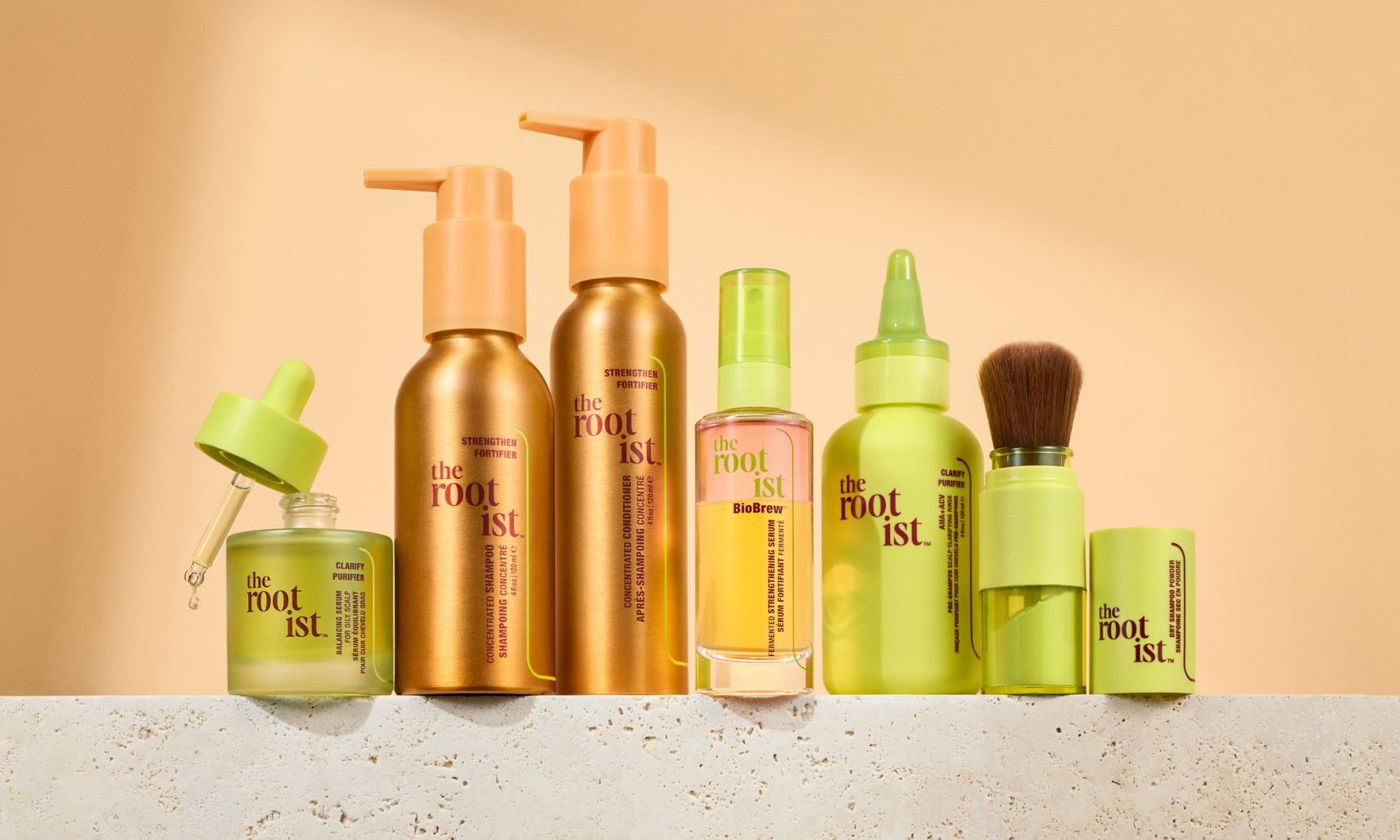 The Rootist products lined up in front of a peach background