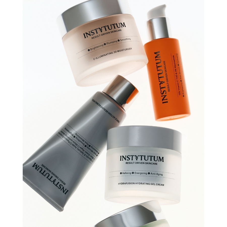 A flatlay of Instytutum skincare products including the C-Illuminating 3D Moisturizer, Hydrafusion Hydrating Gel Cream, and Triple Action Resurfacing Peel against a white backdrop.