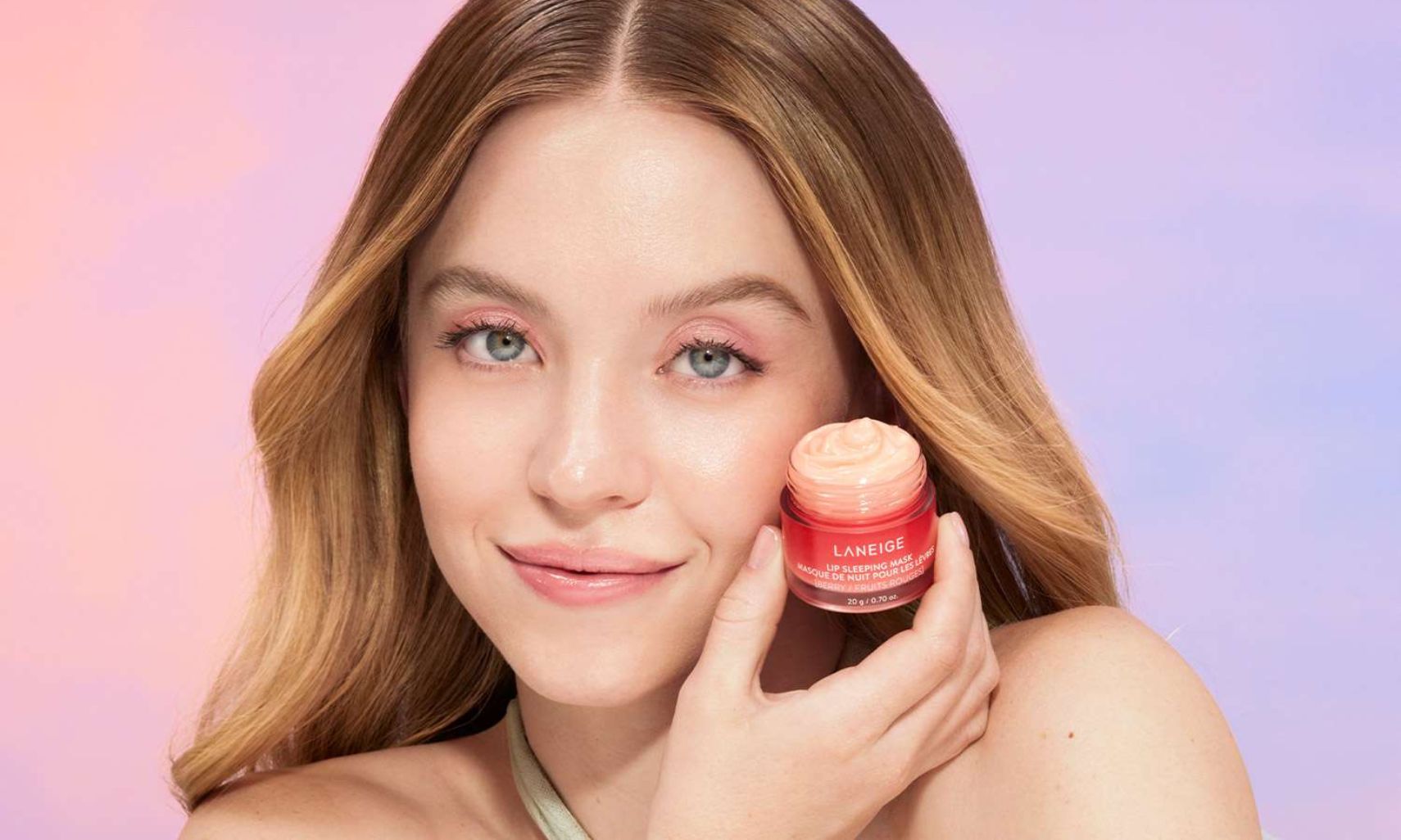 Sydney Sweeney holding the Laneige Lip Sleeping Mask