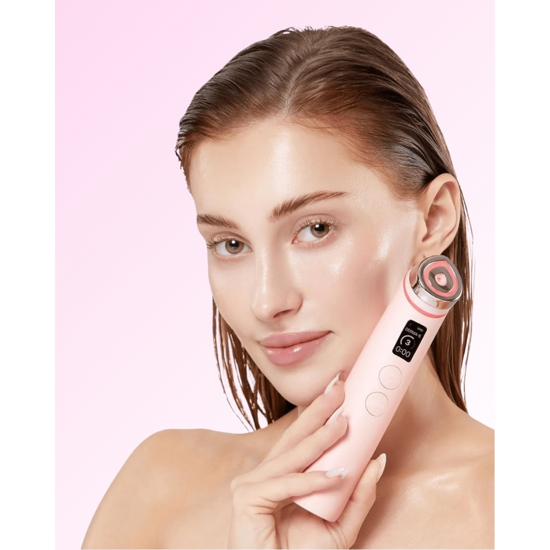 A model with slicked-back hair holding a light pink Medicube Age-R Booster Pro device to her cheek against a soft pink background.