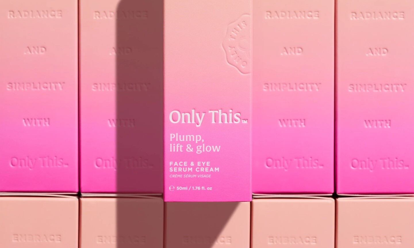 Pink and beige packaging boxes for Only This Plump, Lift & Glow Face & Eye Serum Cream arranged in a repeating grid pattern.