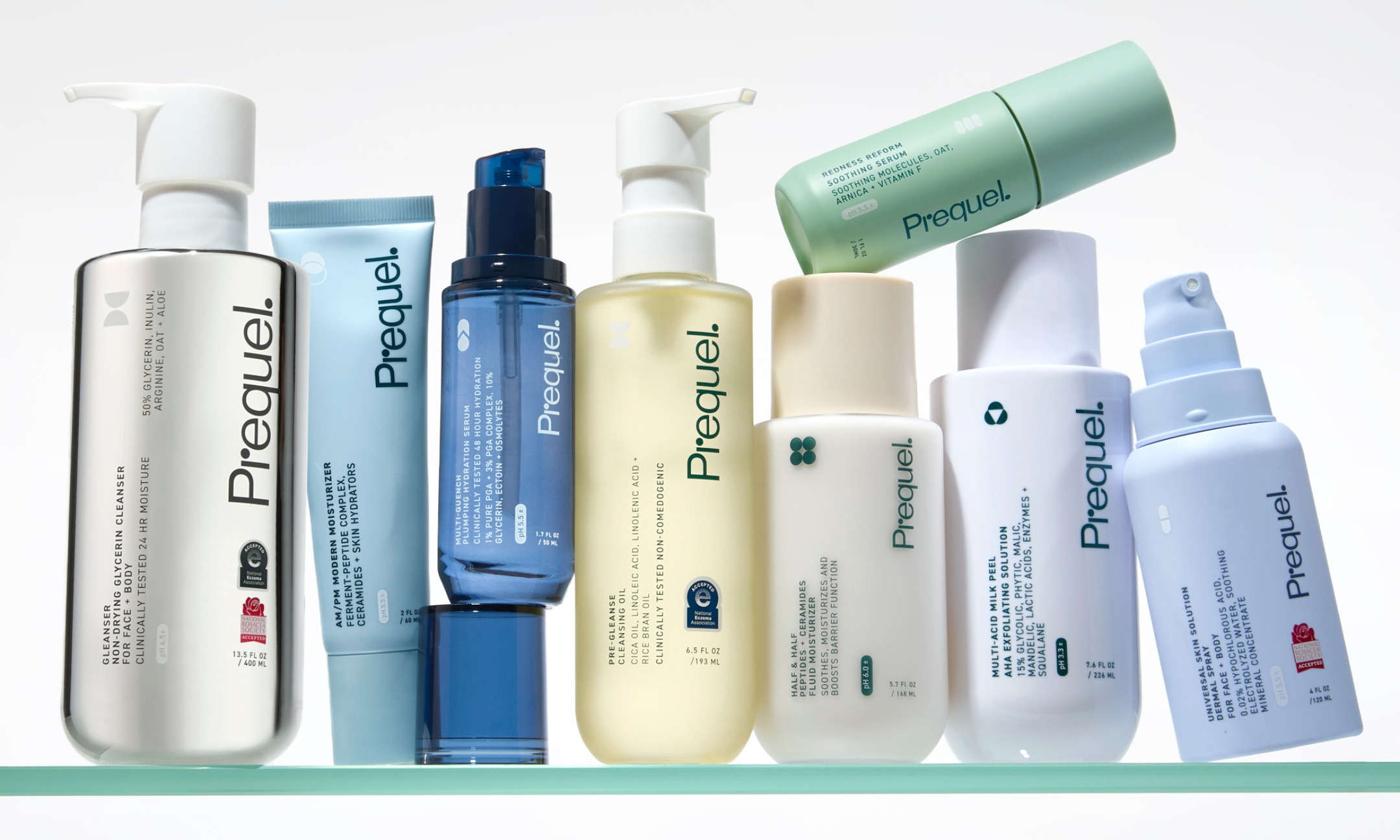 A lineup of Prequel skincare products on a glass shelf to celebrate the brand's UK launch, featured on Beauty News Daily.
