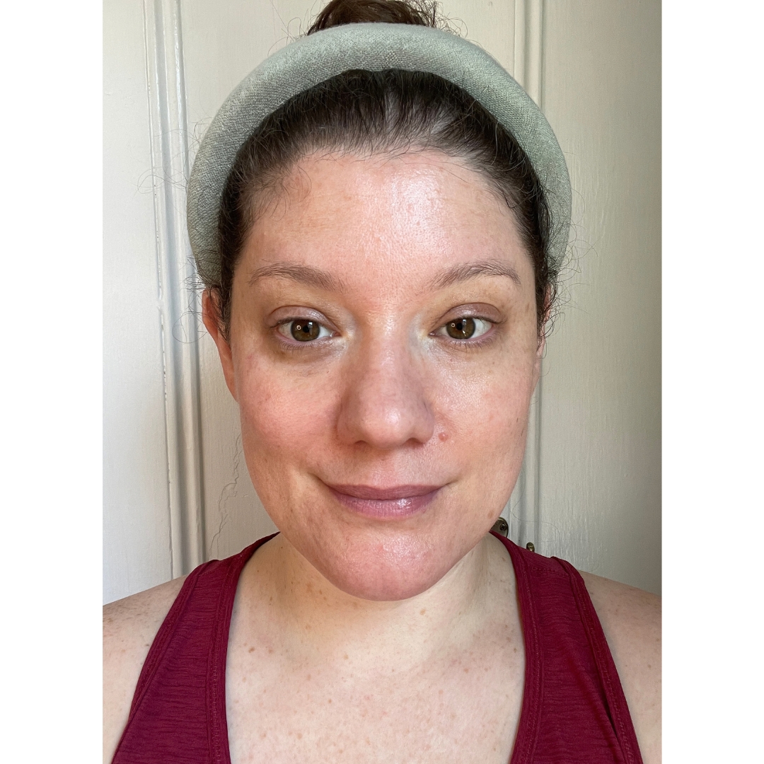 Frontal portrait of journalist tester Sarah Carvalho wearing a light green headband and burgundy tank top prior to starting the Noble Panacea RetiNAD+ Renewal Booster treatment.