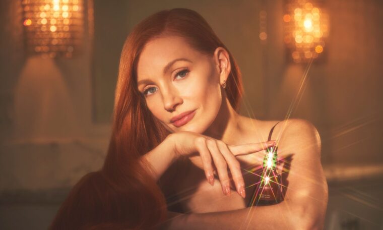 Jessica Chastain holding True Botanicals serum